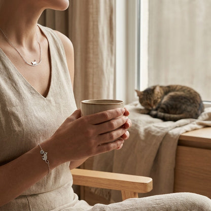 Cat mum wearing the walking cat necklace and matching cat bracelet