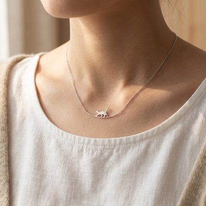 Silver-tone walking cat bar necklace worn