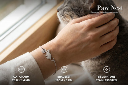 Cat with yarn bracelet worn while stroking a grey cat: cat charm 26.8 x 11.4 mm, bracelet 17 cm plus 5 cm, silver-tone stainless steel
