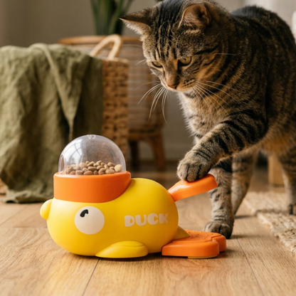 Cat using the DUCK Little Yellow Duck Feeder Toy at home