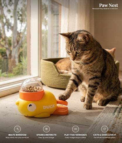 Duck treat-dispensing toy benefits: beats boredom, sparks their instincts, play that rewards, cats and dogs love it. Cat pawing the lever.
