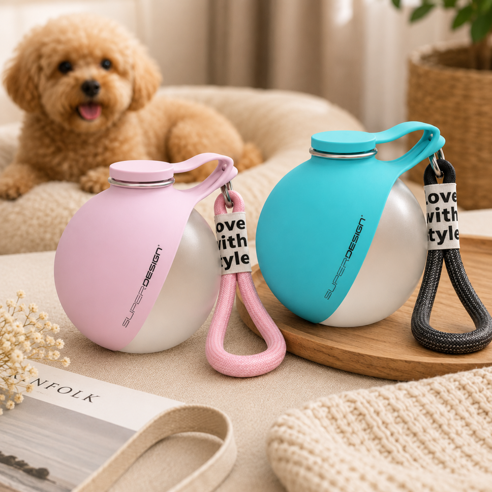 Two dog water bottles, one pink and one blue, on a table with a dog in the background.